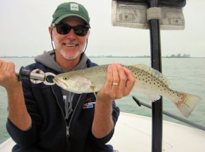 Ron Shay, from VA, with a nice trout caught on a CAL jig with a shad tail while fishing Gasparilla Sound near Boca Grande with Capt. Rick Grassett.